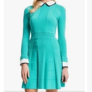 Aqua Brand new long sleeve dress size M with beautifully detailed buttons.